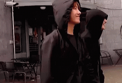 Two Men In Hooded Jackets GIF