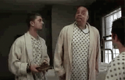 Two Men In Hospital Room One In Gown GIF