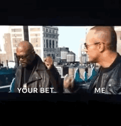 Two Men In Leather Jackets Are Standing Next To Each Other In Front Of A Building . GIF