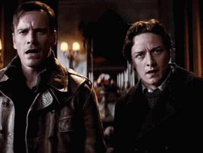 Two Men in Leather Jackets in Dark Room