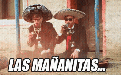 Two Men In Mariachi Outfits Drinking And Smoking GIF
