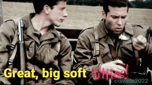 Two Men In Military Uniforms Are Sitting Next To Each Other With The Words Great Big Soft Titties Written On The Bottom GIF