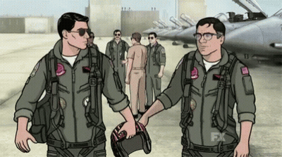 Two Men In Military Uniforms Shaking Hands In Front Of Jets GIF