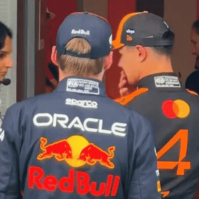 Two Men In Oracle And Redbull Jerseys Talking GIF