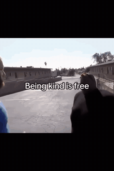 Two Men In Parking Lot Being Kind Is Free GIF