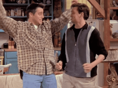 Two Men In Plaid Shirts Are Dancing Together GIF