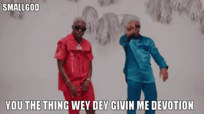 Two Men In Red And Blue Shirts Dancing GIF