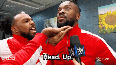 Two Men In Red Jackets Talking GIF