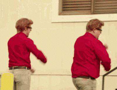 Two Men In Red Shirts Dancing GIF