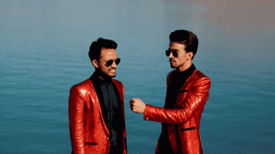 Two Men In Red Suits And Sunglasses GIF