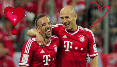 Two Men In Red T-Mobile Jerseys Are Hugging GIF