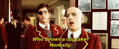 Two Men In School Uniforms One With Eye Patch GIF