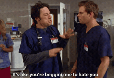 Two Men In Scrubs Talking Saying It's Like You're Begging Me To Hate You GIF