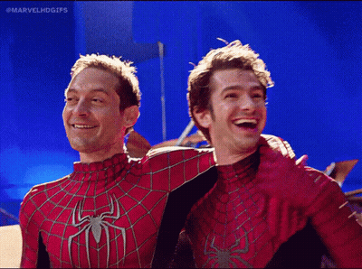 Two Men In Spiderman Costumes Are Posing For A Photo With The Caption Marvelhdgifs GIF