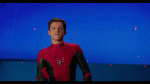 Two Men In Spiderman Costumes Are Posing For A Picture Together GIF
