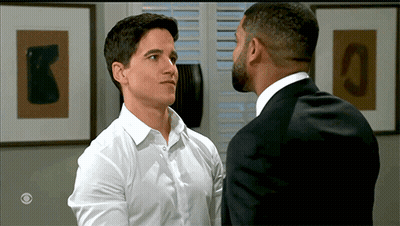 Two Men In Suit And White Shirt Looking At Each Other GIF