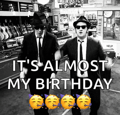 Two Men In Suits And Hats Are Dancing In A Store With The Words It 'S Almost My Birthday GIF