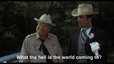 Two Men In Suits And Hats GIF