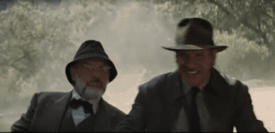 Two Men In Suits And Hats In Foggy Forest GIF