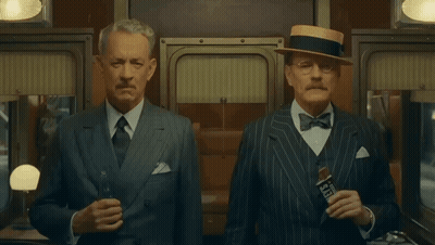 Two Men In Suits And Hats One Holding Seagrams GIF