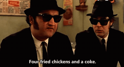 Two Men In Suits And Hats Talking Fried Chicken And Coke GIF