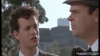 Two Men In Suits And Hats Talking GIF