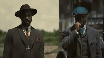 Two Men In Suits And Hats GIF