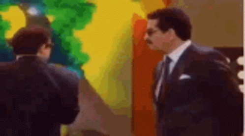 Two Men In Suits And Ties GIF