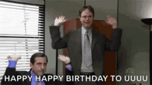 Two Men In Suits And Ties Are Dancing In An Office With The Words Happy Happy Birthday To Uuuu On The Bottom . GIF
