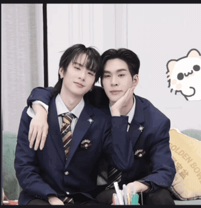 Two Men In Suits And Ties Are Posing For A Picture With A Cat On The Wall GIF