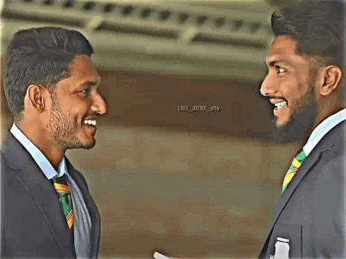 Two Men In Suits And Ties Are Smiling At Each Other And The Words Chic Zone Are On The Bottom Right GIF