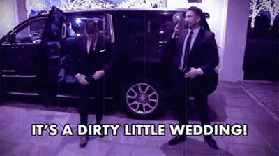 Two Men In Suits And Ties Are Standing In Front Of A Car With The Words It 'S A Dirty Little Wedding .. GIF