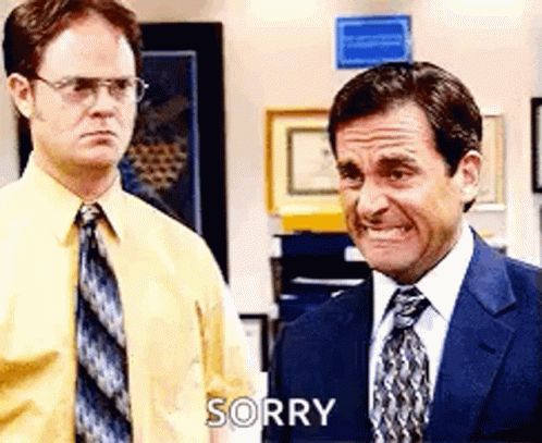 Two Men In Suits And Ties Are Standing Next To Each Other And One Of Them Is Making A Face And Saying Sorry . GIF