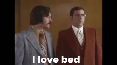 Two Men In Suits And Ties Are Standing Next To Each Other And One Of Them Is Saying I Love Bed . GIF
