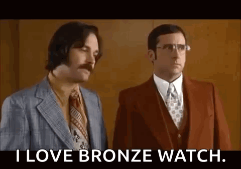 Two Men In Suits And Ties Are Standing Next To Each Other And One Of Them Is Saying `` I Love Bronze Watch '' . GIF