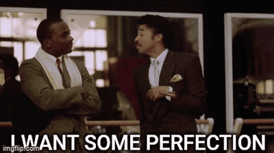 Two Men In Suits And Ties Are Standing Next To Each Other And One Of Them Is Saying I Want Some Perfection . GIF