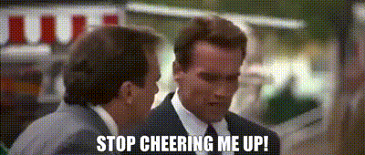 Two Men In Suits And Ties Are Standing Next To Each Other And One Of Them Is Saying Stop Cheering Me Up . GIF