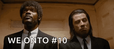 Two Men In Suits And Ties Are Standing Next To Each Other In An Elevator And Looking Up . GIF
