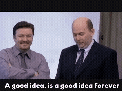 Two Men In Suits And Ties Are Standing Next To Each Other In Front Of A White Board . GIF