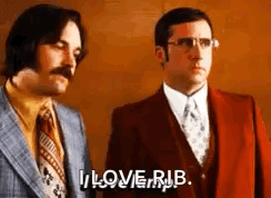 Two Men In Suits And Ties Are Standing Next To Each Other . One Of The Men Is Saying `` I Love Rub '' . GIF