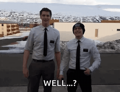 Two Men In Suits And Ties Are Standing Next To Each Other With The Words Well Written On The Bottom GIF