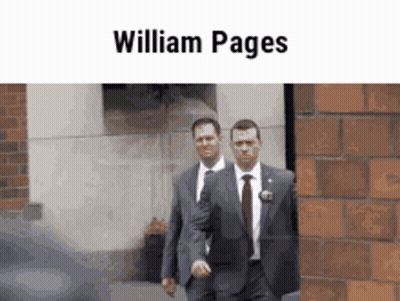 Two Men In Suits And Ties Are Walking In Front Of A Brick Wall With The Name William Pages On The Top GIF