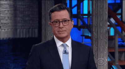 Two Men In Suits And Ties Drinking Coffee Saying Bravo GIF
