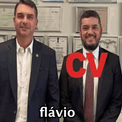 Two Men In Suits And Ties In Front Of Certificates GIF
