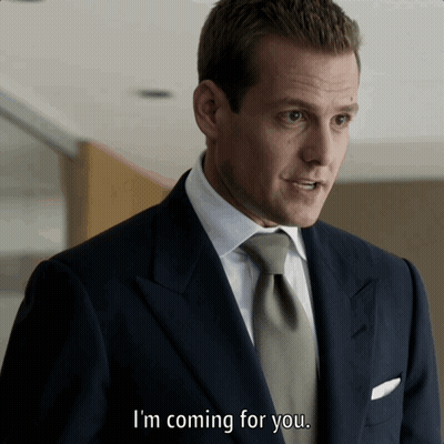 Two Men In Suits And Ties Standing Together GIF