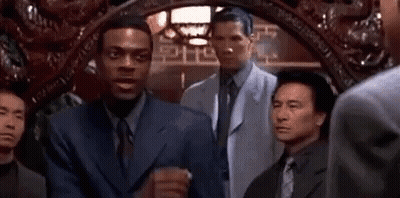 Two Men In Suits And Ties Talking GIF