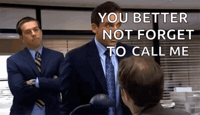Two Men In Suits And Ties Talking GIF