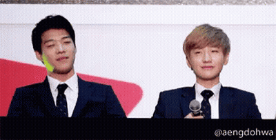 Two Men In Suits And Ties With Name Aengdohwa GIF