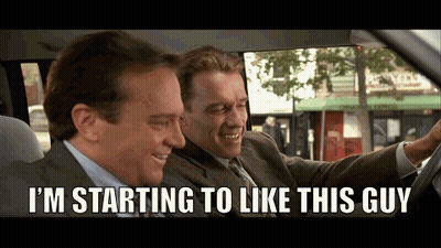 Two Men In Suits Are Sitting In A Car And One Of Them Is Saying I 'M Starting To Like This Guy GIF