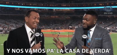 Two Men In Suits Are Talking To Each Other In Front Of A Fox Stadium GIF